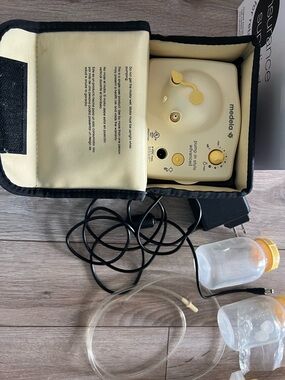 Medela Portable Electric Breast Pump in Yellow and Black